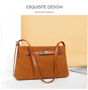 Brown suede shoulder bag detail showing metallic turn lock closure and fine texture.
