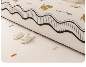 Detailed close-up of vintage chenille sofa cover featuring cute dog print and wave edge.