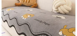 Grey chenille sofa cover with cute puppy print and woven text, cozy home decor protector.