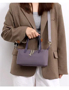 Women waterproof nylon crossbody bag, mini shoulder handbag with chain detail and grey strap.
