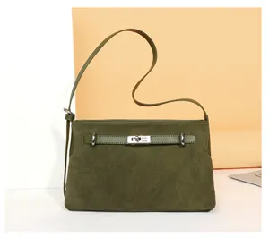 Dark green suede shoulder bag for women, elegant commuter tote with metal lock and strap.
