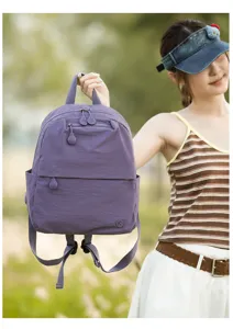 Casual purple nylon backpack for women, lightweight stylish commuter bookbag with multi pockets.