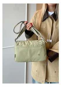 Casual multi-layer nylon crossbody shoulder bag for women, lightweight and practical daily use.