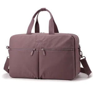 Detail view of women travel gym duffel bag with wet dry separation and durable handles.