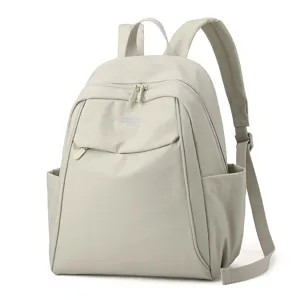 Casual nylon backpack for women, large capacity stylish school bookbag for travel use.