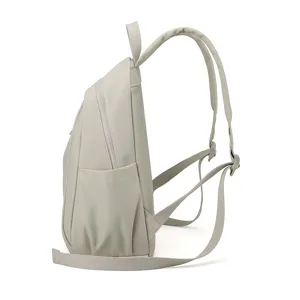 Side detail view of lightweight grey nylon casual backpack, spacious travel daypack for women.
