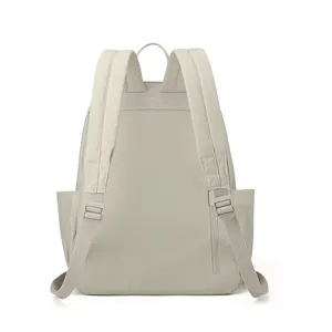 Light beige nylon backpack back detail, featuring adjustable straps and rear zipper.