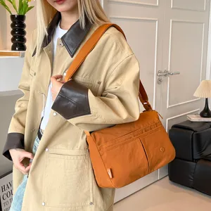 Casual multi-layer canvas crossbody shoulder bag for women, large capacity and lightweight.