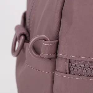 Close-up view of durable nylon gym bag showing fine stitching, D-ring and smooth zipper.