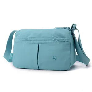 Cyan nylon multi-pocket crossbody bag detail, casual style, daily use, practical design.