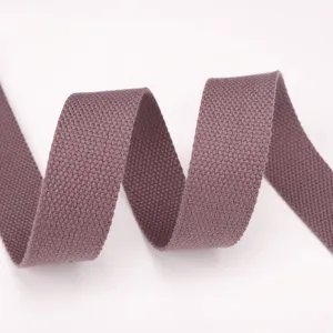 Detailed view of durable mauve woven webbing strap, showing dense texture for bag making.