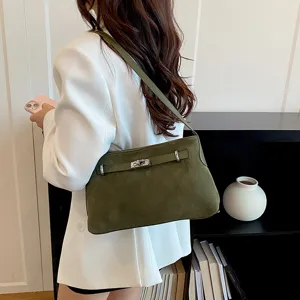 Green suede shoulder bag with metal lock detail, elegant daily commuter crossbody handbag.