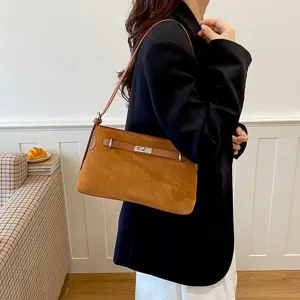 Brown suede shoulder bag detail, stylish women commuting crossbody bag with metal lock.