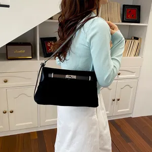 Black suede shoulder bag for women, elegant casual crossbody purse with metal lock design.