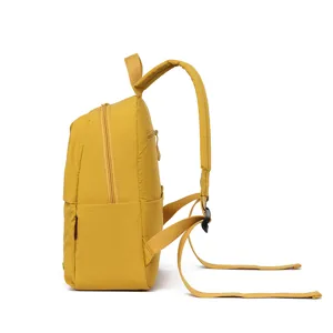 Yellow minimalist backpack side view showing pocket structure and adjustable straps for daily commute.