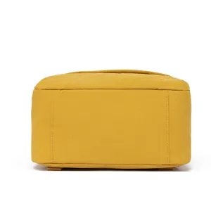 Yellow casual daily backpack detail view, lightweight student school bag and travel daypack.