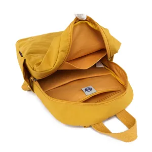 Yellow casual nylon backpack with zip closure and multi compartments for daily commute travel