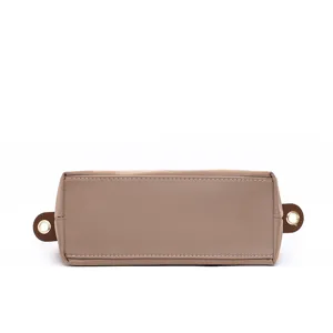 Waterproof nylon crossbody bag bottom detail, minimalist mini shoulder bag fashion design.