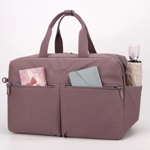Multifunctional travel duffel bag for women, waterproof gym bag with wet dry separation design.
