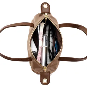 Detailed interior view of the waterproof nylon handbag showing spacious compartments and storage.