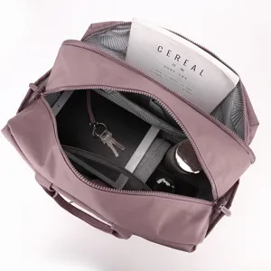 Travel duffel bag interior detail, large capacity gym bag with dry wet separation in mauve.