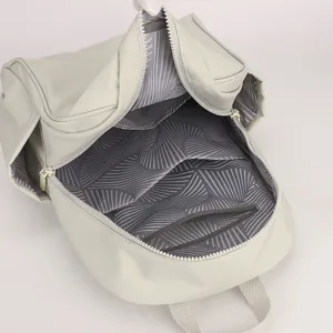 Backpack interior detail showing spacious compartment and lining, durable nylon material design.