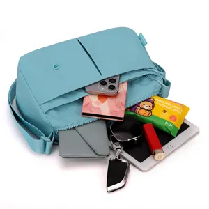 Lightweight casual multi-layer crossbody bag with large capacity for daily essentials.