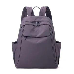 Stylish purple nylon backpack for women, large capacity casual school bag for daily travel.