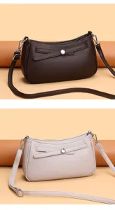 Detailed view of women's stylish leather shoulder bag, minimalist design texture.