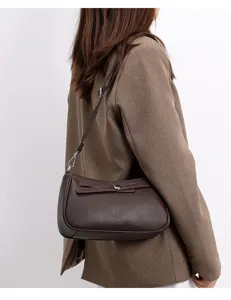 Detailed view of trendy brown leather shoulder bag, casual versatile minimalist design for daily.