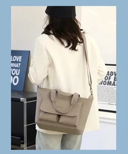 Vue de détail du sac cabas en nylon léger montrant la poignée et le style de voyage quotidien.