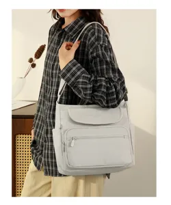 Casual grey crossbody shoulder bag for women, multi-pocket stylish canvas daily purse.