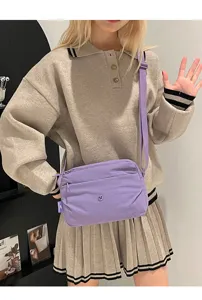 Casual purple canvas crossbody bag for women, multi-layer zipper design with wide strap.