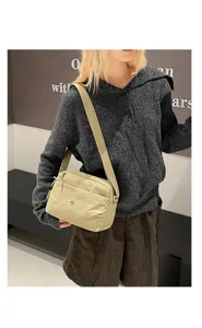 Lightweight multi-layer canvas crossbody bag, casual womens shoulder bag detail.