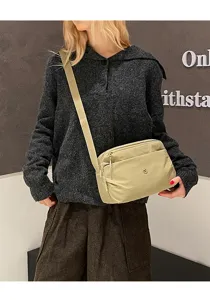 Casual multi-layer canvas crossbody bag for women, versatile shoulder bag for daily use.