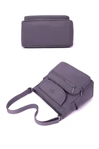 Purple nylon crossbody shoulder bag detail, multi-compartment design with adjustable strap.