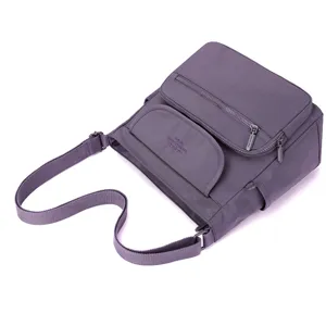 Stylish purple nylon women shoulder crossbody bag with multi pockets and adjustable strap.