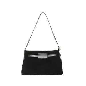Detailed view of black suede shoulder bag, minimalist commuting handbag with stylish front strap.