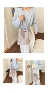 Pink studded bucket bag with chain strap, stylish PU leather shoulder bag for daily use.