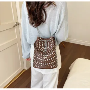 Brown litchi pattern rhinestone bucket bag, stylish punk retro single shoulder crossbody bag.