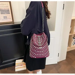 Purple studded bucket bag with chain strap, litchi grain leather punk style shoulder bag.