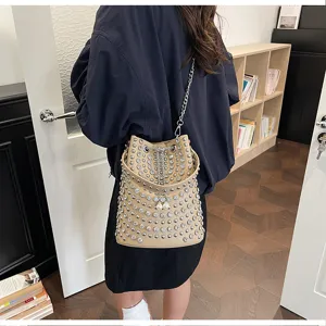 Detailed view of the stylish rhinestone studded bucket bag with chain strap and chic design.