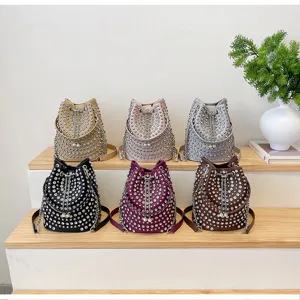 Litchi pattern rivet bucket bag detailed view showcasing various color options clearly.