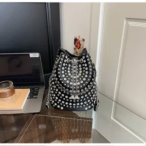 Black litchi grain rhinestone bucket bag with rivet studs, chain strap and chic design.