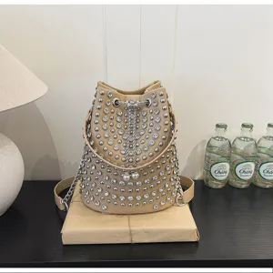 Beige litchi pattern bucket bag with shiny studs and rhinestones, stylish punk shoulder bag.
