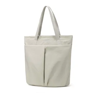 Detailed view of the lightweight waterproof nylon laptop tote bag in elegant light grey color.