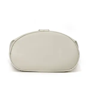 Close-up detail showing the smooth bottom structure of a minimalist casual handbag.