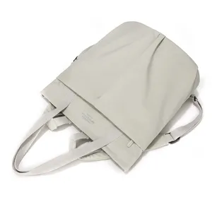 Lightweight waterproof nylon laptop tote bag multi-way convertible shoulder backpack.