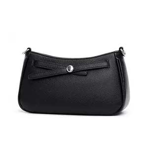Black leather shoulder bag with chic bow detail and silver hardware for daily wear