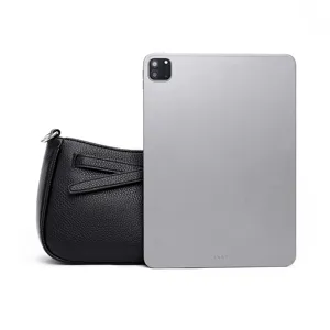 Black textured leather shoulder bag minimalist design casual crossbody bag detail view.